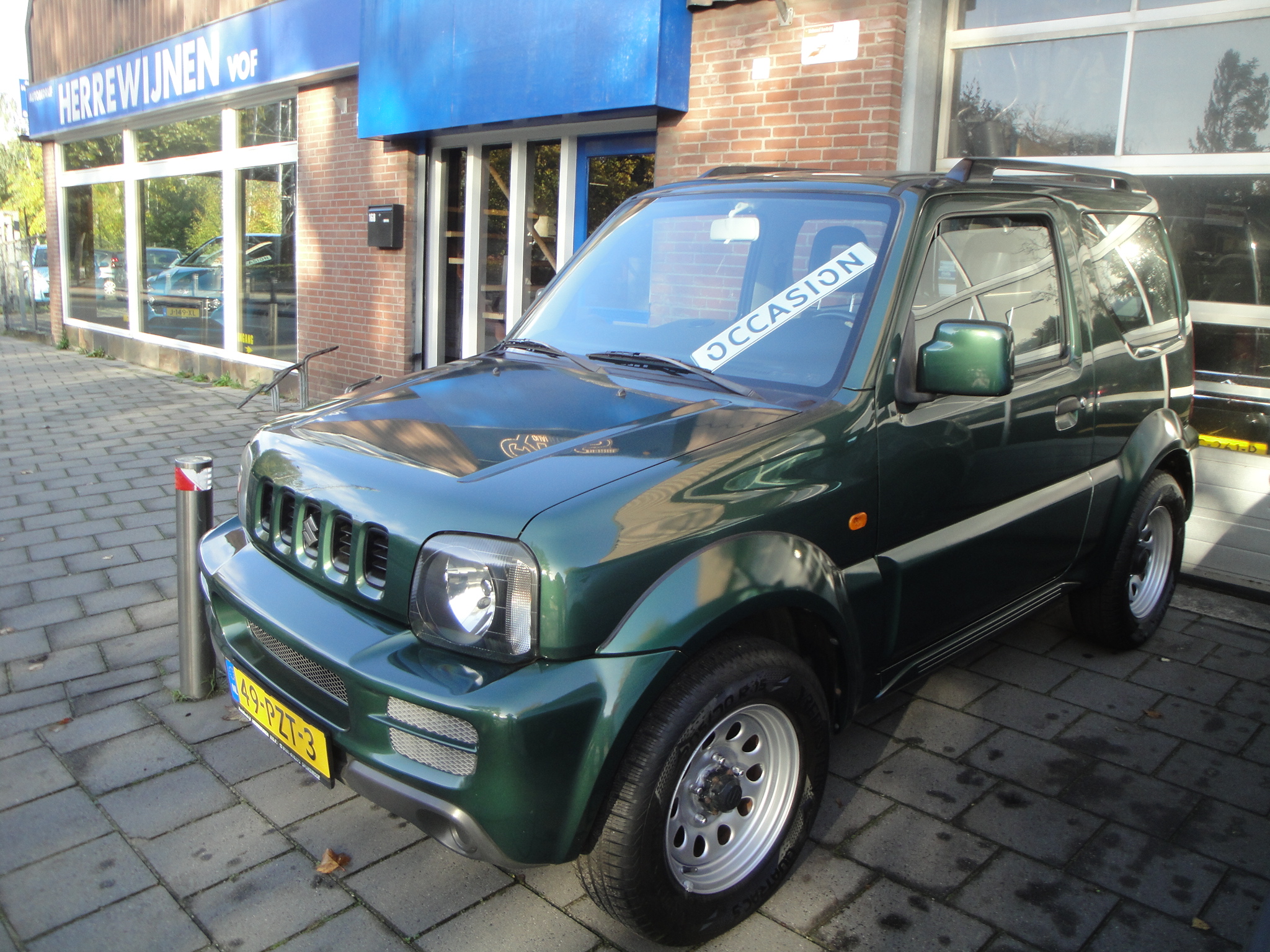 Suzuki Jimny 1.3 JLX TOP 4WD (1e Eig./2011/86.600KM) met o.a. All-Weather banden.